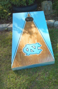 Wooden UNC cornhole board with blue triangle